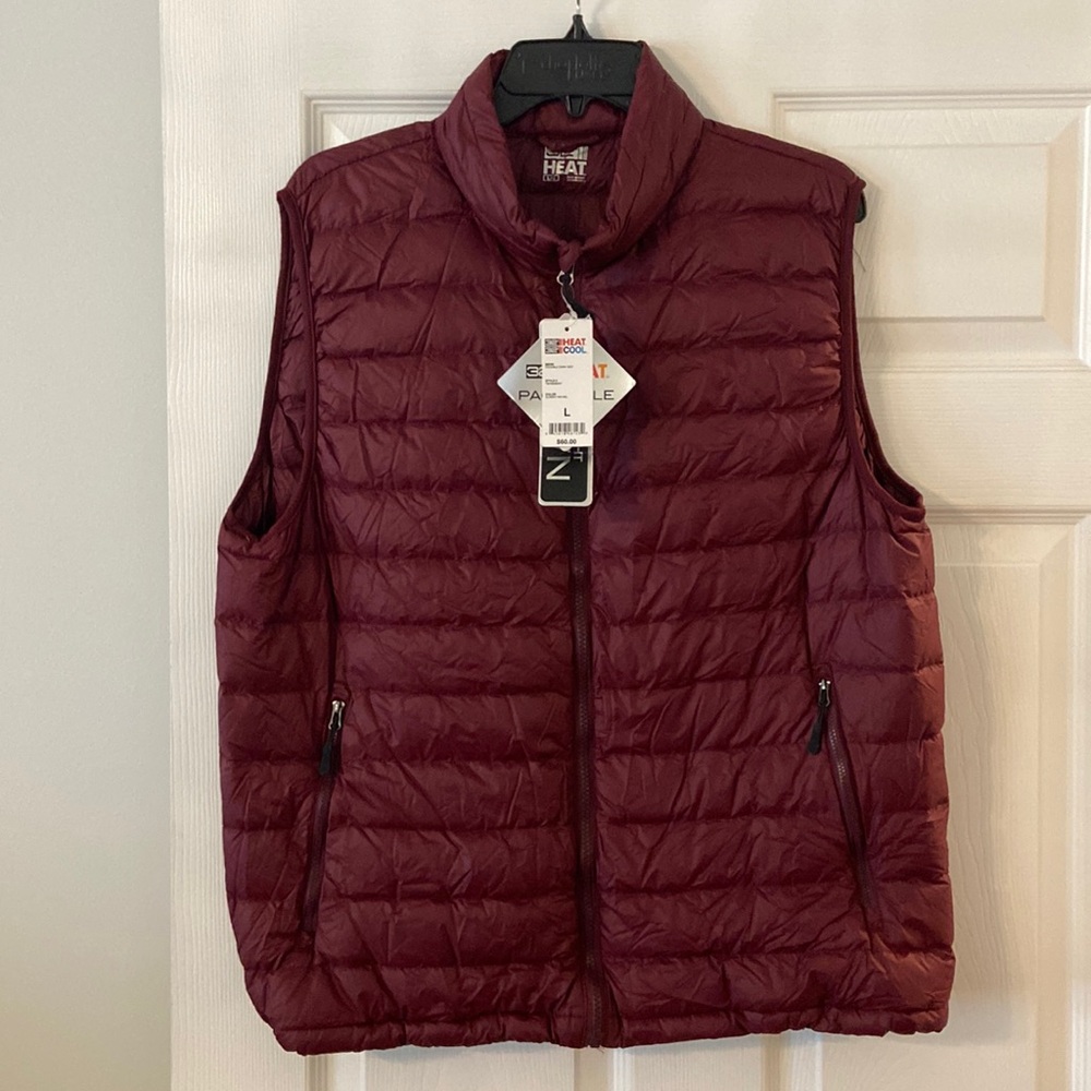 32Heat Packable Man Vest size L brand new with tag two front pockets with zipper
